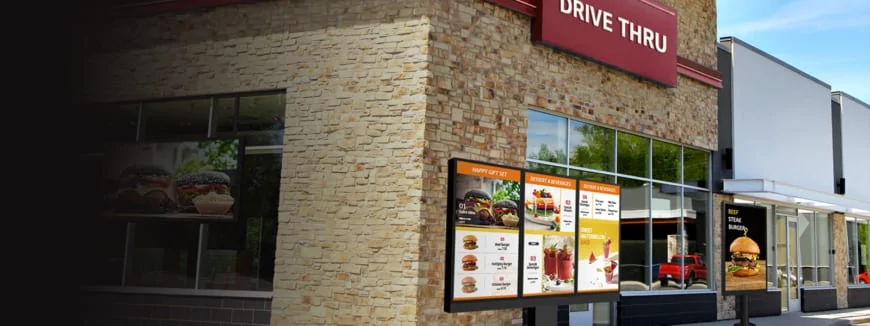 Outdoor digital menu board digital signage at fast food restaurant drive-thru