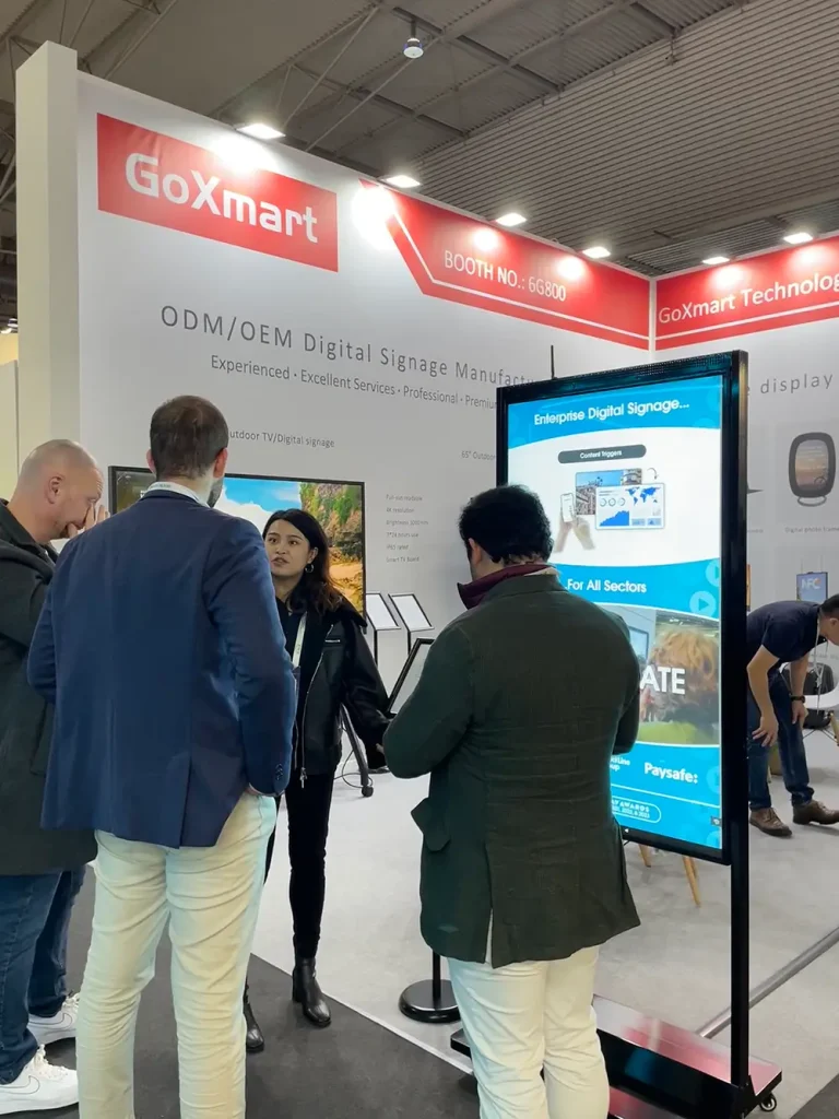 GoXmart staff introducing digital signage display products to international buyers at ISE