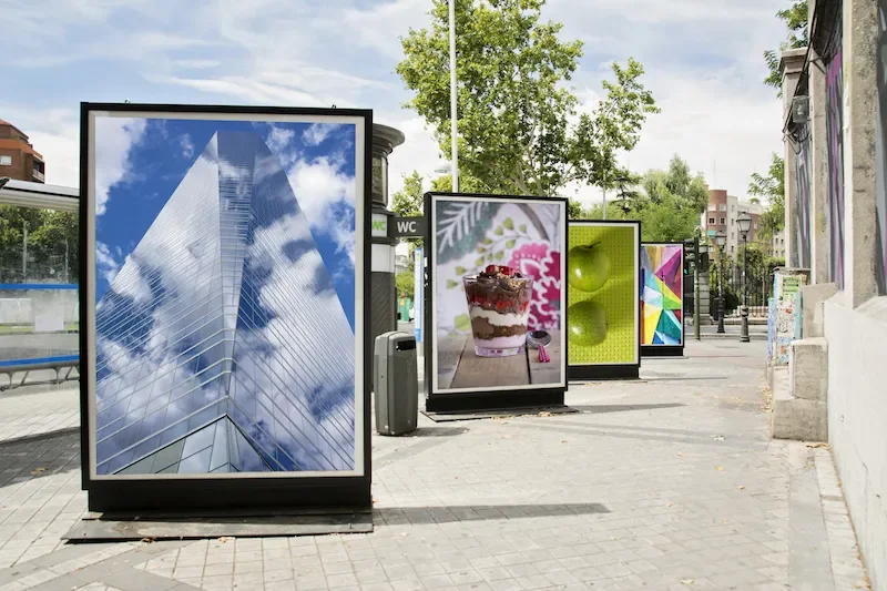 Outdoor digital advertising signage displays on city street for commercial promotion