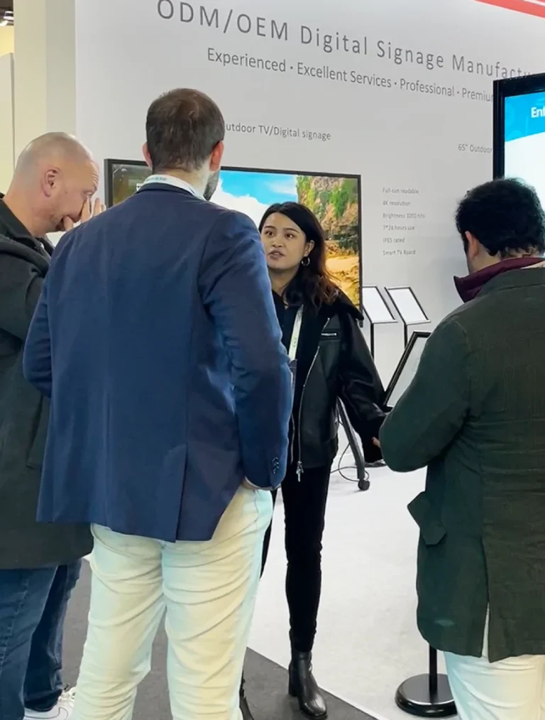 goxmart sales representative introduces outdoor high brightness digital signage to visitors at ISE show