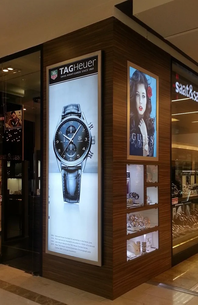 goxmart vertical stretched retail digital signage screens installed at luxury watch store in shopping mall