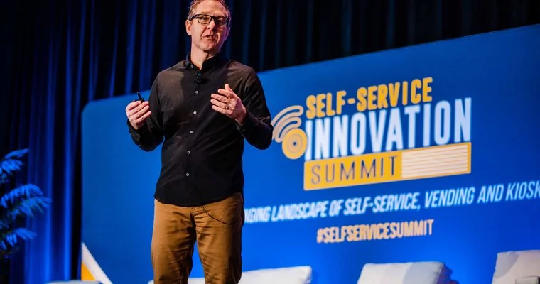 Speaker delivering speech at Self-Service Innovation Summit about 5G, edge computing and IoT technology
